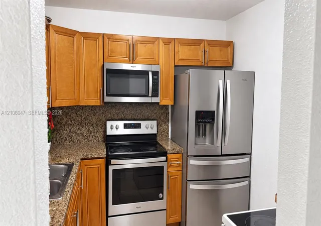 Listing Photo 1 - Condo for sale in building located at 11905 Ne 2Nd Ave, Miami, FL 33161 - Unit #C301