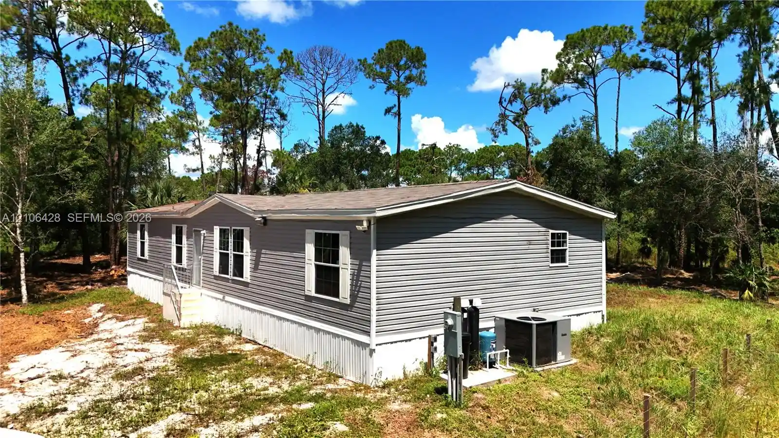 Photo 1 of Manufactured home for sale at 881 Woodland Blvd, Clewiston, FL 33440 | MLS# A12106428 | Listing updated on 2026-10-14