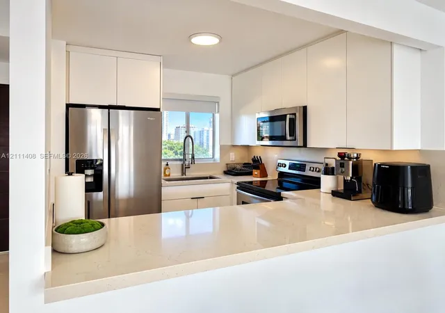 Listing Photo 1 - Condo for sale in building located at 1700 N River Dr, Miami, FL 33125 - Unit #1004