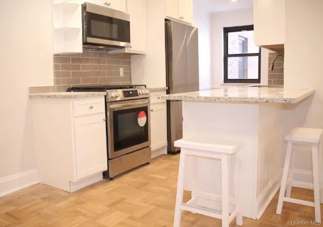 Listing Photo 1 - Condo for sale in building located at 50 White Oak St, New Rochelle, NY 10801 - Unit #1C