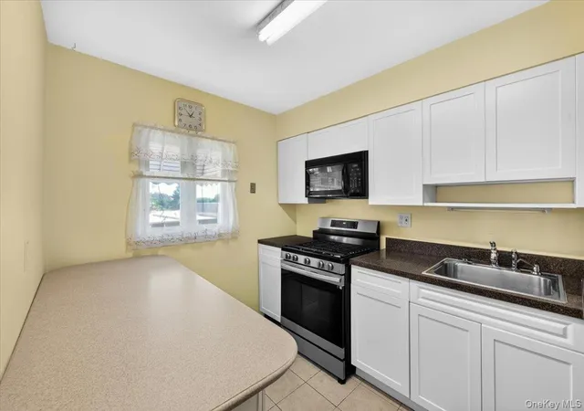 Listing Photo 4 - Condo for sale in building located at 72-41 52nd Ave, New York, NY 11378
