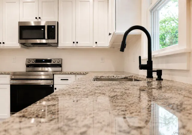 Photo 3 of Sale Pending at 32 Groveland Park Blvd, Brookhaven, NY 11789 | MLS# 1018351 | Listing updated on 2026-08-21