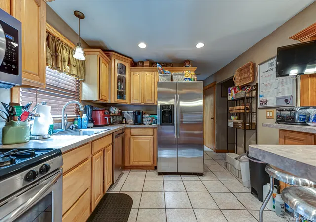 Photo 3 of Sale Pending at 11 Berkshire Dr, Brookhaven, NY 11784 | MLS# 1019225 | Listing updated on 2026-09-19