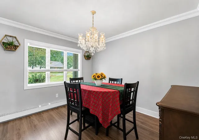 Photo 4 of Single family home for sale at 8 Singingwood Dr, Brookhaven, NY 11741 | MLS# 1032301 | Listing updated on 2026-09-05