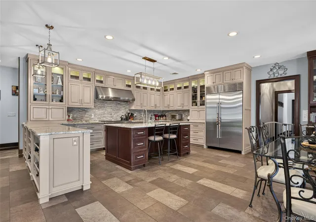 Photo 4 of Single family home for sale at 23 Gloria Ln, Huntington, NY 11743 | MLS# 1036110 | Listing updated on 2026-08-14