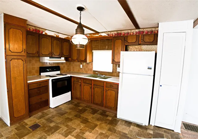 Photo 3 of Manufactured home for sale at 703 Fresh Pond Ave #55, Riverhead, NY 11933 | MLS# 1037046 | Listing updated on 2026-10-05