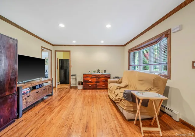 Photo 3 of Single family home for sale at 24 Oakcrest Ave, Brookhaven, NY 11953 | MLS# 1038189 | Listing updated on 2026-08-16