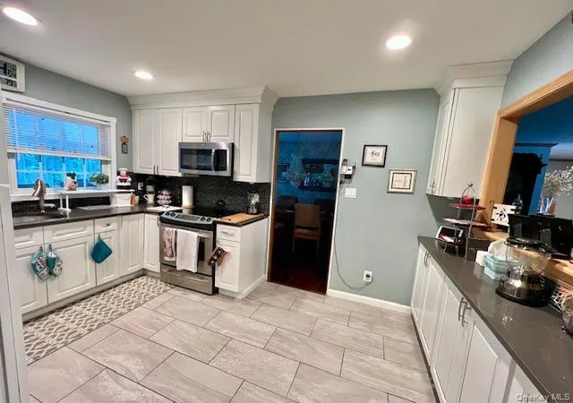 Photo 4 of Sale Pending at 7 Cedar Ave, Brookhaven, NY 11727 | MLS# 1038353 | Listing updated on 2026-09-16