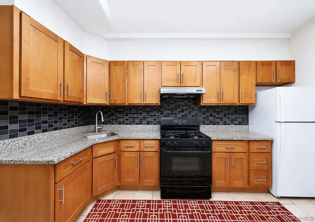 Photo 3 of Multi family home for sale at 91 14 86th Drive, New York, NY 11421 | MLS# 1039522 | Listing updated on 2026-10-08