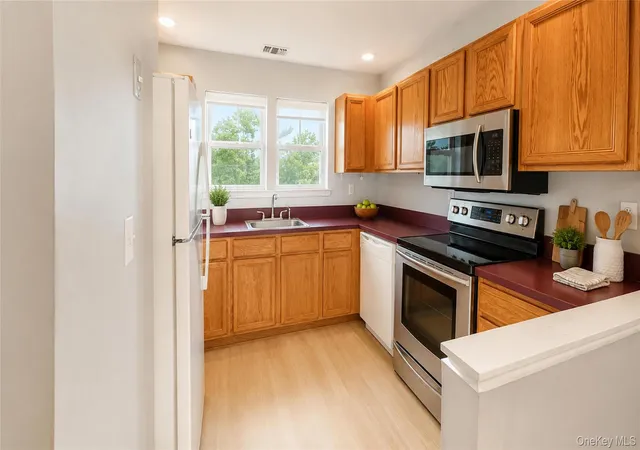 Photo 2 of Condo for sale at 53 Village Cir E #E053, Brookhaven, NY 11949 | MLS# 1040329 | Listing updated on 2026-09-08