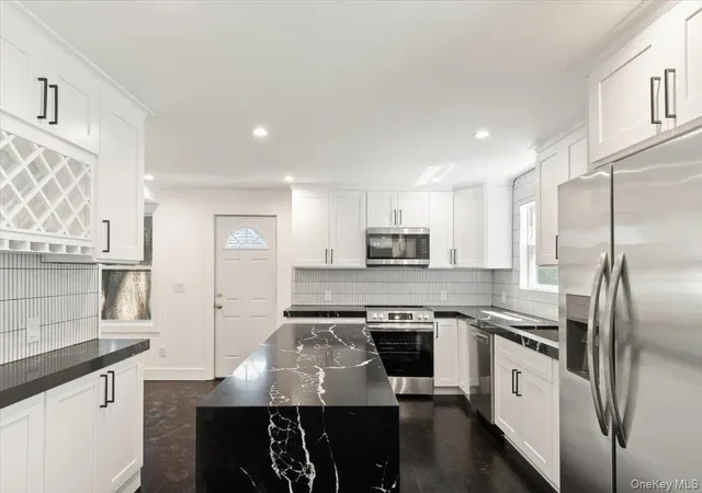 Photo 2 of Single family home for sale at 8 Elm Dr, Huntington, NY 11731 | MLS# 1040531 | Listing updated on 2026-08-20
