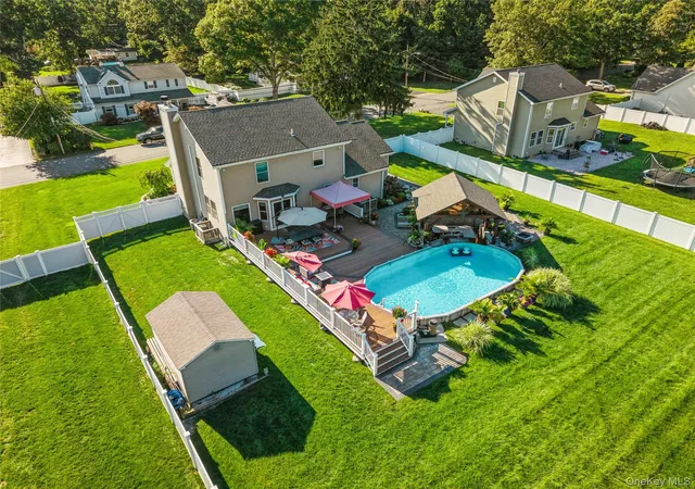 Photo 2 of Single family home for sale at 406 Carnation Dr, Brookhaven, NY 11967 | MLS# 1042746 | Listing updated on 2026-10-06