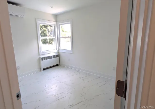 Photo 2 of Single family home for sale at 11 Wood St, Hempstead, NY 11563 | MLS# 1047701 | Listing updated on 2026-10-02
