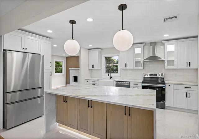 Photo 3 of Single family home for sale at 14 Camelot Ln, Brookhaven, NY 11733 | MLS# 1048233 | Listing updated on 2026-10-04