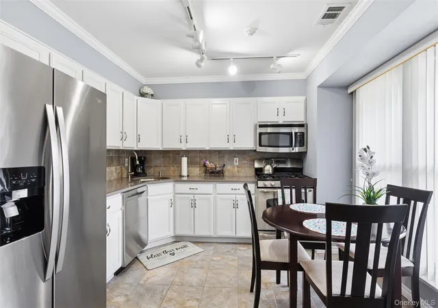 Photo 2 of Sale Pending at 2 Hemlock Ct #2, Brookhaven, NY 11784 | MLS# 1048532 | Listing updated on 2026-09-23