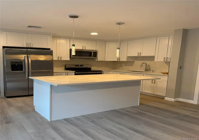 Photo 2 of Single family home for sale at 21 Astoria Rd, Brookhaven, NY 11951 | MLS# 1048803 | Listing updated on 2026-09-24