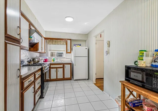 Photo 4 of Single family home for sale at 1107 137th Street, New York, NY 11356 | MLS# 1051380 | Listing updated on 2026-09-18