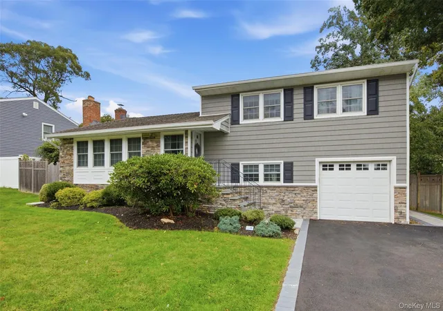 Photo 2 of Single family home for sale at 23 Apple Tree Dr, Smithtown, NY 11788 | MLS# 1053726 | Listing updated on 2026-09-29