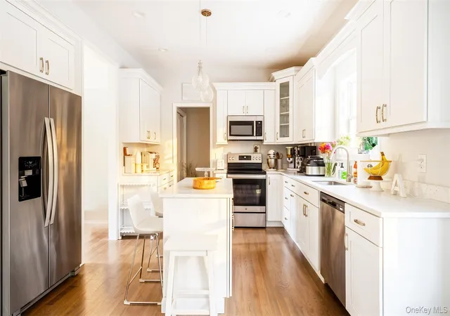 Photo 2 of Single family home for sale at 24 Belmont Rd, Brookhaven, NY 11789 | MLS# 1054924 | Listing updated on 2026-10-06