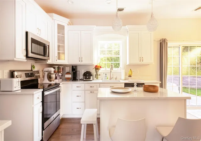 Photo 4 of Single family home for sale at 24 Belmont Rd, Brookhaven, NY 11789 | MLS# 1054924 | Listing updated on 2026-10-06