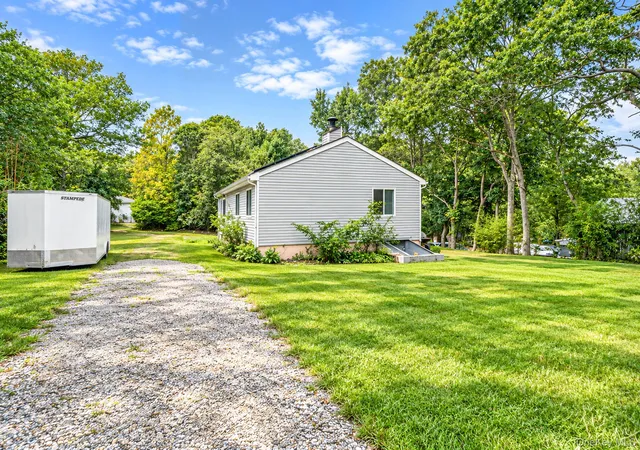 Photo 2 of Single family home for sale at 95 W Bartlett Rd, Brookhaven, NY 11953 | MLS# 1056935 | Listing updated on 2026-10-08