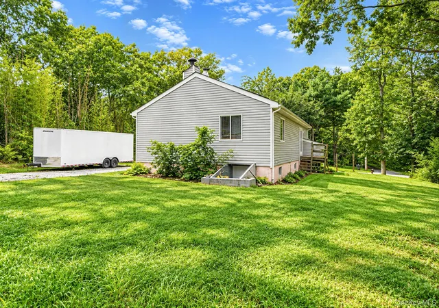 Photo 3 of Single family home for sale at 95 W Bartlett Rd, Brookhaven, NY 11953 | MLS# 1056935 | Listing updated on 2026-10-08