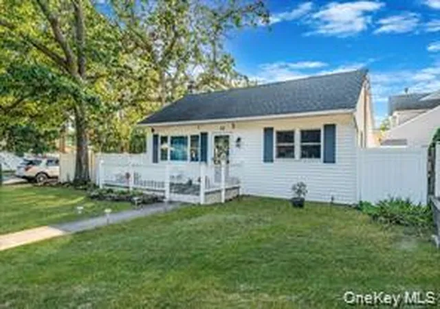 Photo 2 of Single family home for sale at 32 Pine Tree Dr, Brookhaven, NY 11967 | MLS# 1057350 | Listing updated on 2026-10-07