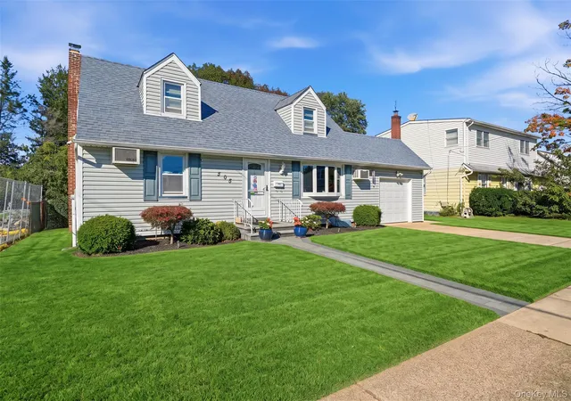 Photo 2 of Single family home for sale at 305 W Nicholai St, Hicksville, NY 11801 | MLS# 1060113 | Listing updated on 2026-10-08