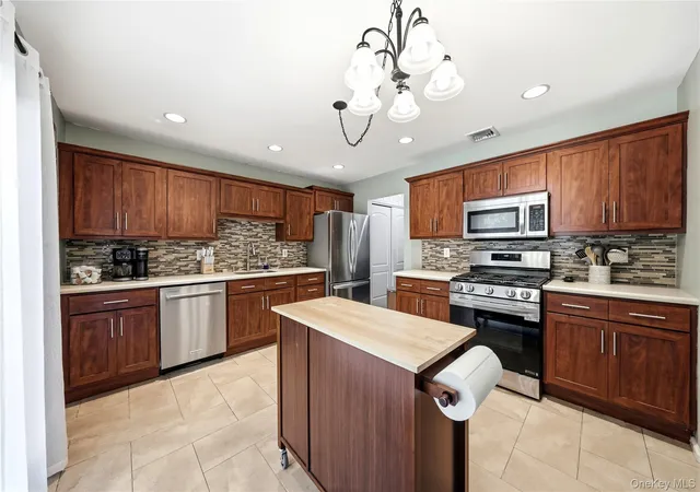 Photo 4 of Single family home for sale at 50 Timber Ridge Dr, Coram, NY 11727 | MLS# 1060138 | Listing updated on 2026-10-13