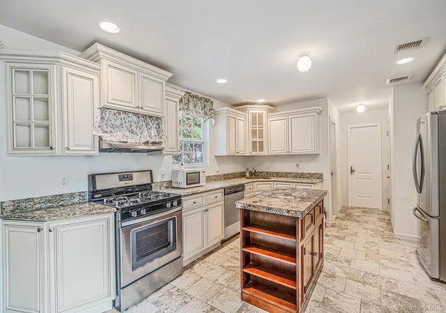 Photo 3 of Single family home for sale at 13 Glenmore Ave, Islip, NY 11717 | MLS# 1063566 | Listing updated on 2026-10-24