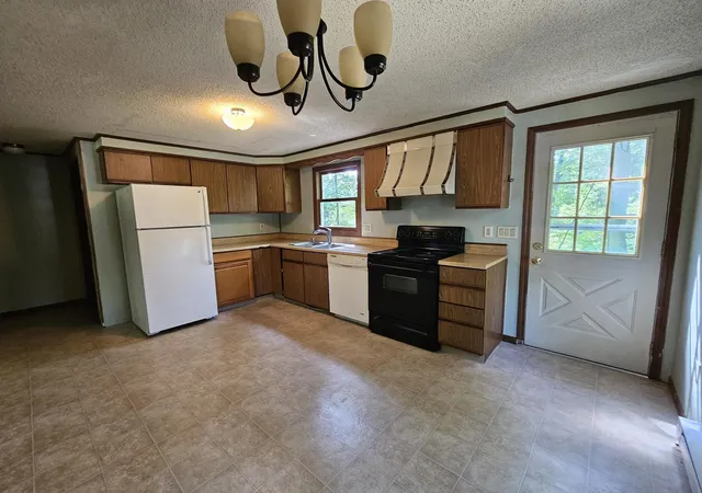 Photo 3 of Multi family home for sale at 94 Wason Rd, Hudson, NH 03051 | MLS# 5100474 | Listing updated on 2026-07-29