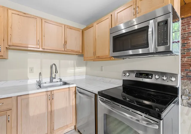 Photo 3 of Condo for sale at 335 Cypress St #1A, Manchester, NH 03103 | MLS# 5103341 | Listing updated on 2026-09-11