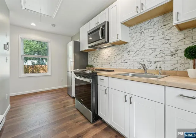 1st image of 57 Riverlawn Dr, Wayne, NJ 07470 | MLS# 25041651
