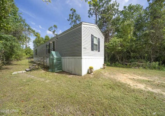 1st image of 12539 Silver Lake Rd, Fountain, FL 32438 | MLS# 779968