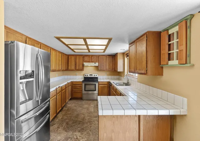 Photo 3 of Single family home for sale at 15500 Elkhorn Ln, Reno, NV 89506 | MLS# 250052890 | Listing updated on 2025-11-12