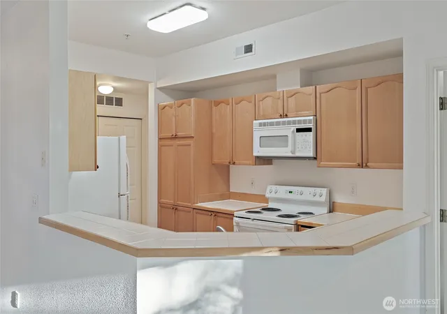 Photo 3 of Condo for sale at 12122 NE 171st Place #D201, Bothell, WA 98011 | MLS# NWM2504485 | Listing updated on 2026-08-16