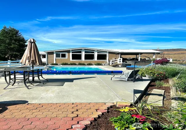 Photo 1 of Manufactured home for sale at 7667 Tarpiscan Rd, Malaga, WA 98828 | MLS# NWM2533350 | Listing updated on 2026-09-21