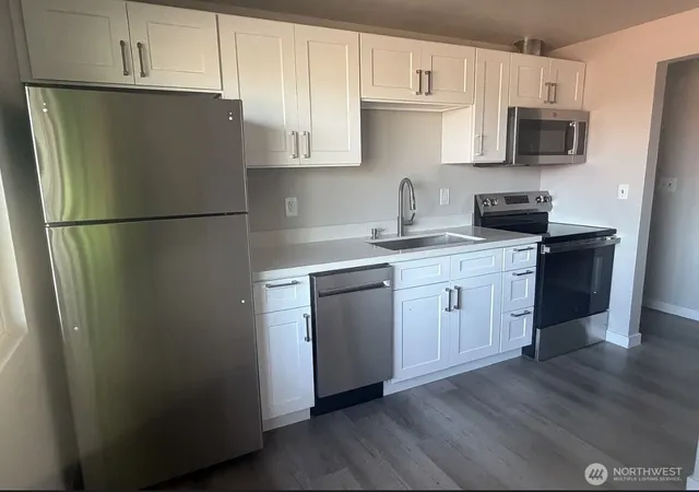 Photo 2 of Multi family home for sale at 404 S Division Ln, Tacoma, WA 98418 | MLS# NWM2556271 | Listing updated on 2026-09-22