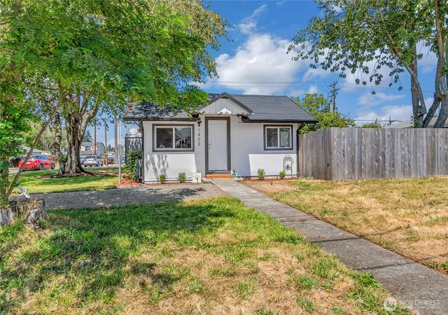 Photo 2 of Single family home for sale at 1403 E 64th Street, Tacoma, WA 98404 | MLS# NWM2557152 | Listing updated on 2026-09-22