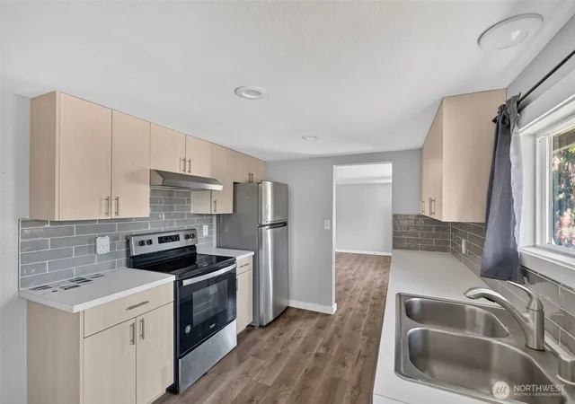 Photo 3 of Single family home for sale at 1402 Violet Meadow St S, Tacoma, WA 98444 | MLS# NWM2558381 | Listing updated on 2026-09-23