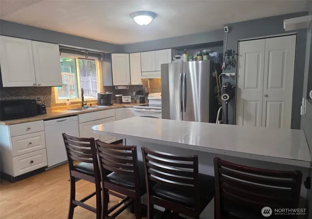 Photo 2 of Single family home for sale at 8910 Ne Quinault Loop, Olympia, WA 98516 | MLS# NWM2585396 | Listing updated on 2026-09-26