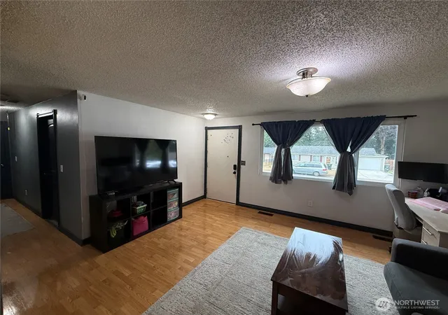 Photo 4 of Single family home for sale at 8910 NE Quinault Loop, Olympia, WA 98516 | MLS# NWM2585396 | Listing updated on 2026-09-26