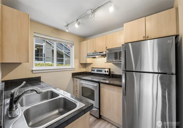 Photo 3 of Condo for sale at 10619 SE 261st Place #E106, Kent, WA 98030 | MLS# NWM2591720 | Listing updated on 2026-10-12