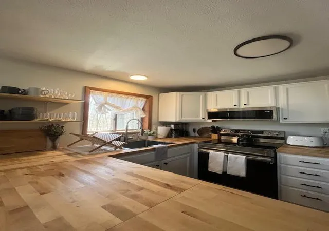 Photo 3 of Single Family Residence at 460 Maxatawny Dr, Pocono Lake, PA 18347 | MLS# PM-133100 | | Sold on 2026-01-14