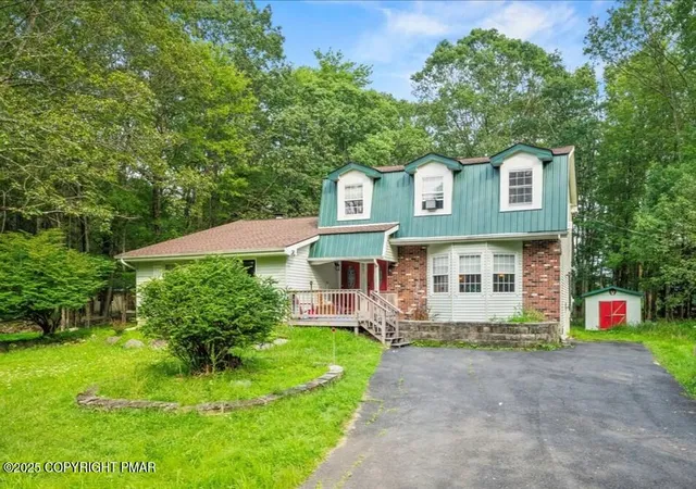 Photo 1 of Single family home for sale at 2102 Woodland Ct, Pocono Summit, PA 18346 | MLS# PM-134642 | Listing updated on 2025-10-30