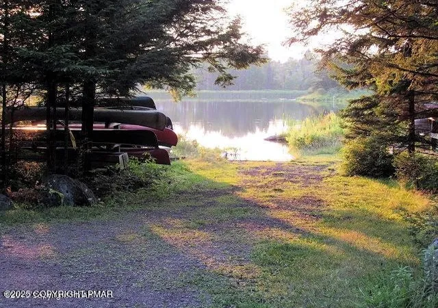 Photo 4 of Single Family Residence at 122 Sawmill Rd, Pocono Lake, PA 18347 | MLS# PM-136314 | | Sold on 2025-11-19
