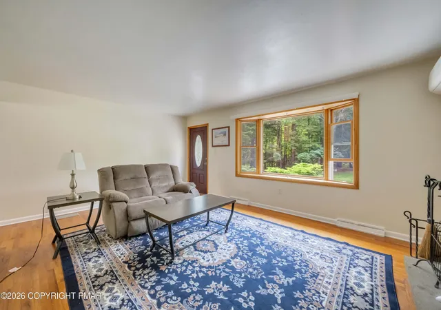 Photo 4 of Single family home for sale at 6469 Laurel Rd, Pocono Summit, PA 18346 | MLS# PM-143944 | Listing updated on 2026-09-21