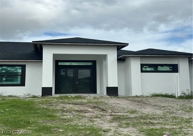 Photo 2 of Single family home for sale at 703 Coolidge Ave, Lehigh Acres, FL 33936 | MLS# 225016403 | Listing updated on 2025-12-30