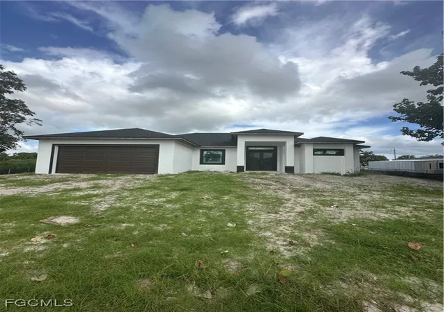 Photo 3 of Single family home for sale at 703 Coolidge Ave, Lehigh Acres, FL 33936 | MLS# 225016403 | Listing updated on 2025-12-30