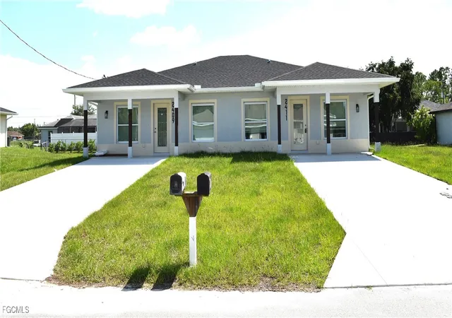 1st image of 2409/2411 Churchill Ave N, Lehigh Acres, FL 33971 | MLS# 2025003301